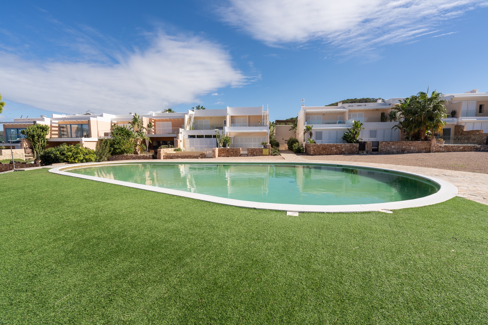 Resa Estates Ibiza sale ted koop Cala Tarida patio townhouse comm pool ok.JPG